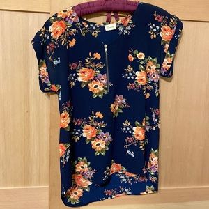 Navy blue, women’s floral blouse.